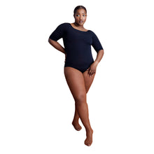 Load image into Gallery viewer, Female model wearing CAPEZIO Professional Fishnet Seamless Tight, Style: 3000 , Color: Toffee, View: Front.