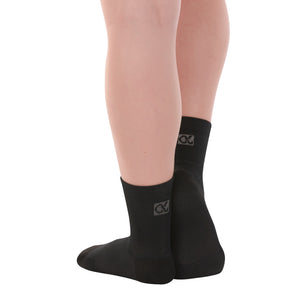 Female model wearing APOLLA Performance Crew Support Socks. Style: Performance. Color: Black. View: Back, Side.