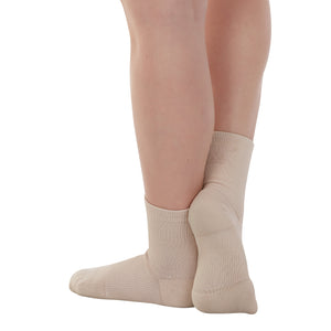 Female model wearing APOLLA Performance Crew Support Socks. Style: Performance. Color: Nude 1. View: Back, Side.