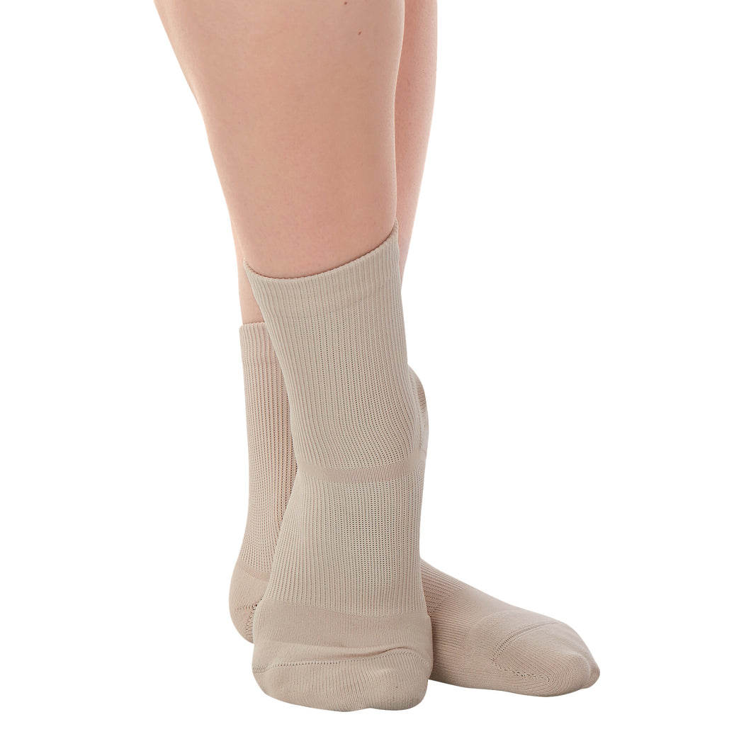 Female model wearing APOLLA Performance Crew Support Socks. Style: Performance. Color: Nude 1. View: Front, Side.