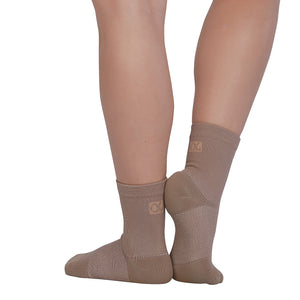 Female model wearing APOLLA Performance Crew Support Socks. Style: Performance. Color: Nude 2. View: Back, Side.