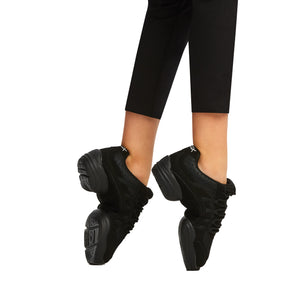 Female model wearing Capezio Rock It Dansneaker, style SD24, color black.