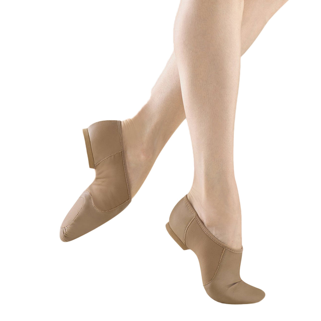 Female model wearing BLOCH Neo Flex Slip On Leather Jazz Shoe - Kids. Style: S0495G. Color: Tan. View: Side.